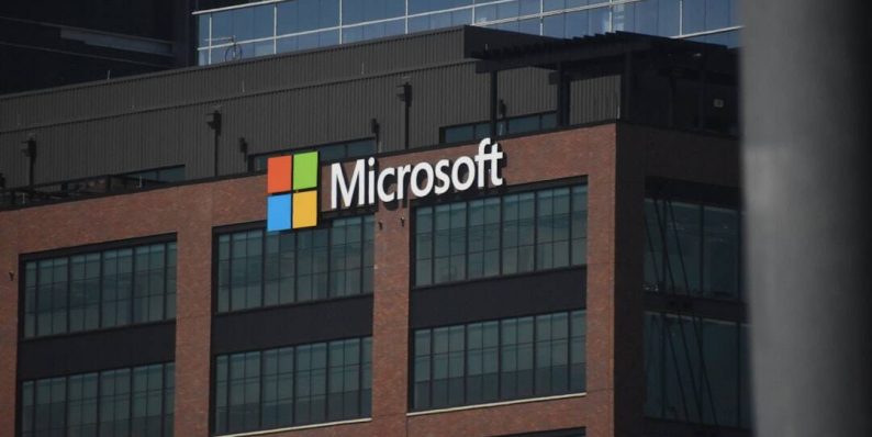 A tall building with a microsoft logo on top of it windows store error, authentication fail, Microsoft account