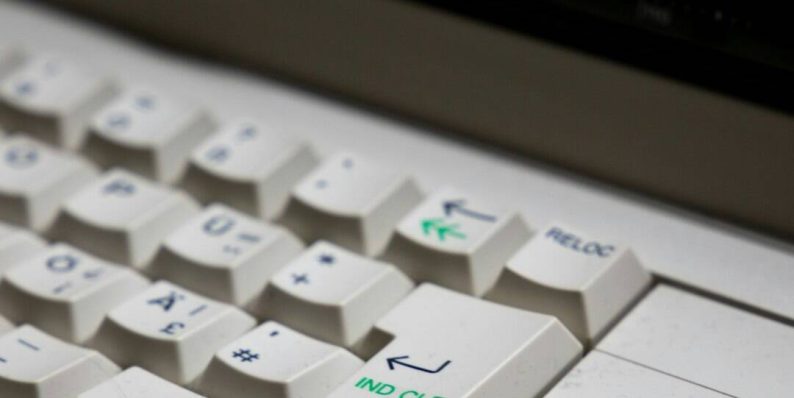 white computer keyboard on gray surface keyboard switches, mechanical keyboard, closeup keys