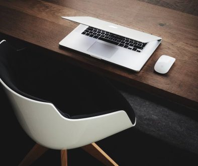 Apple MacBook beside computer mouse on table artificial intelligence, reverse image search, computer screen
