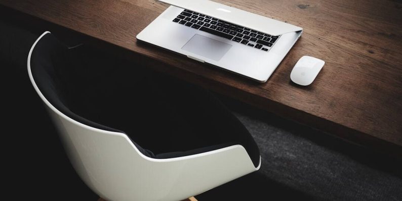 Apple MacBook beside computer mouse on table artificial intelligence, reverse image search, computer screen