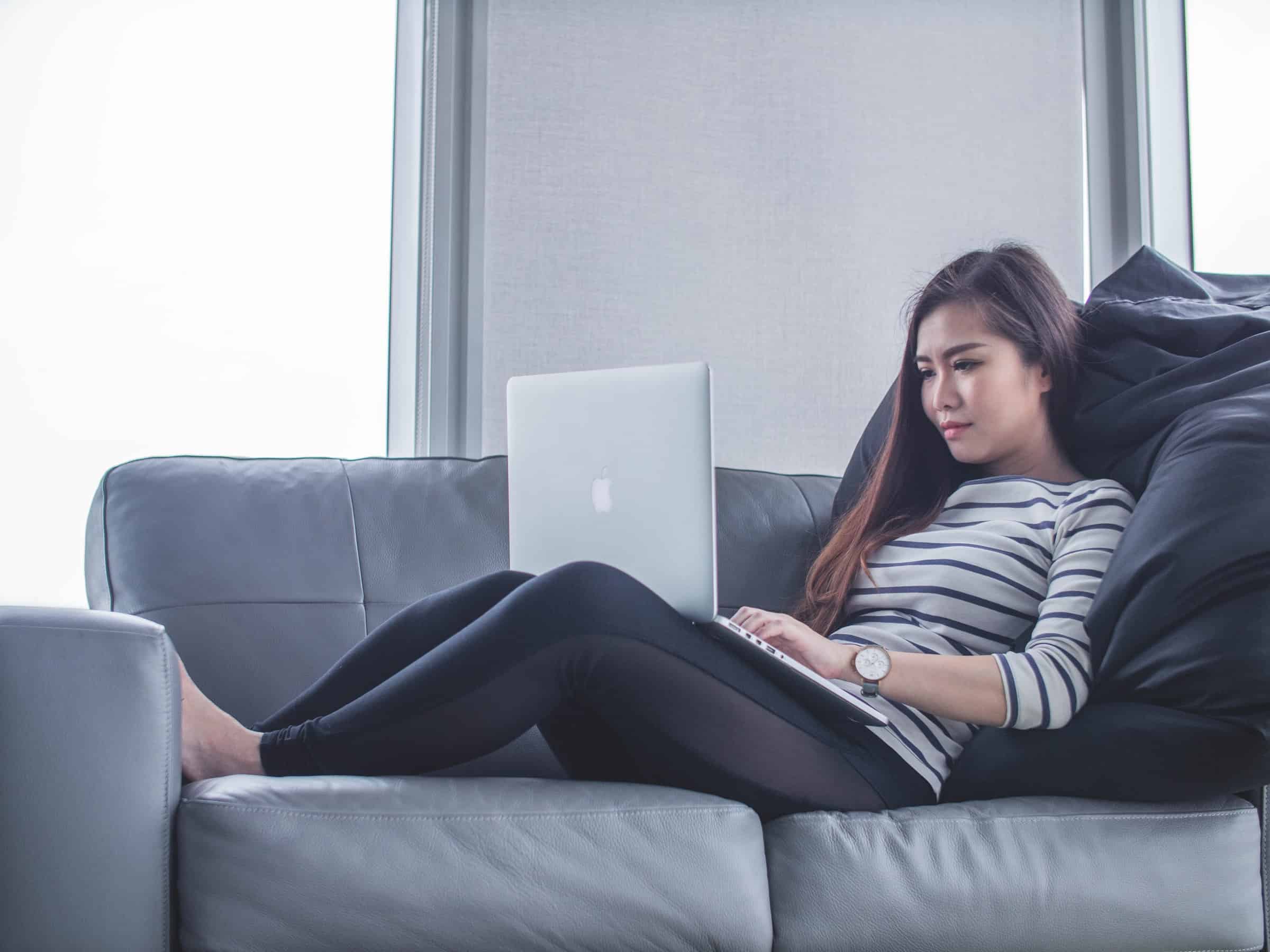 Woman reading from laptop