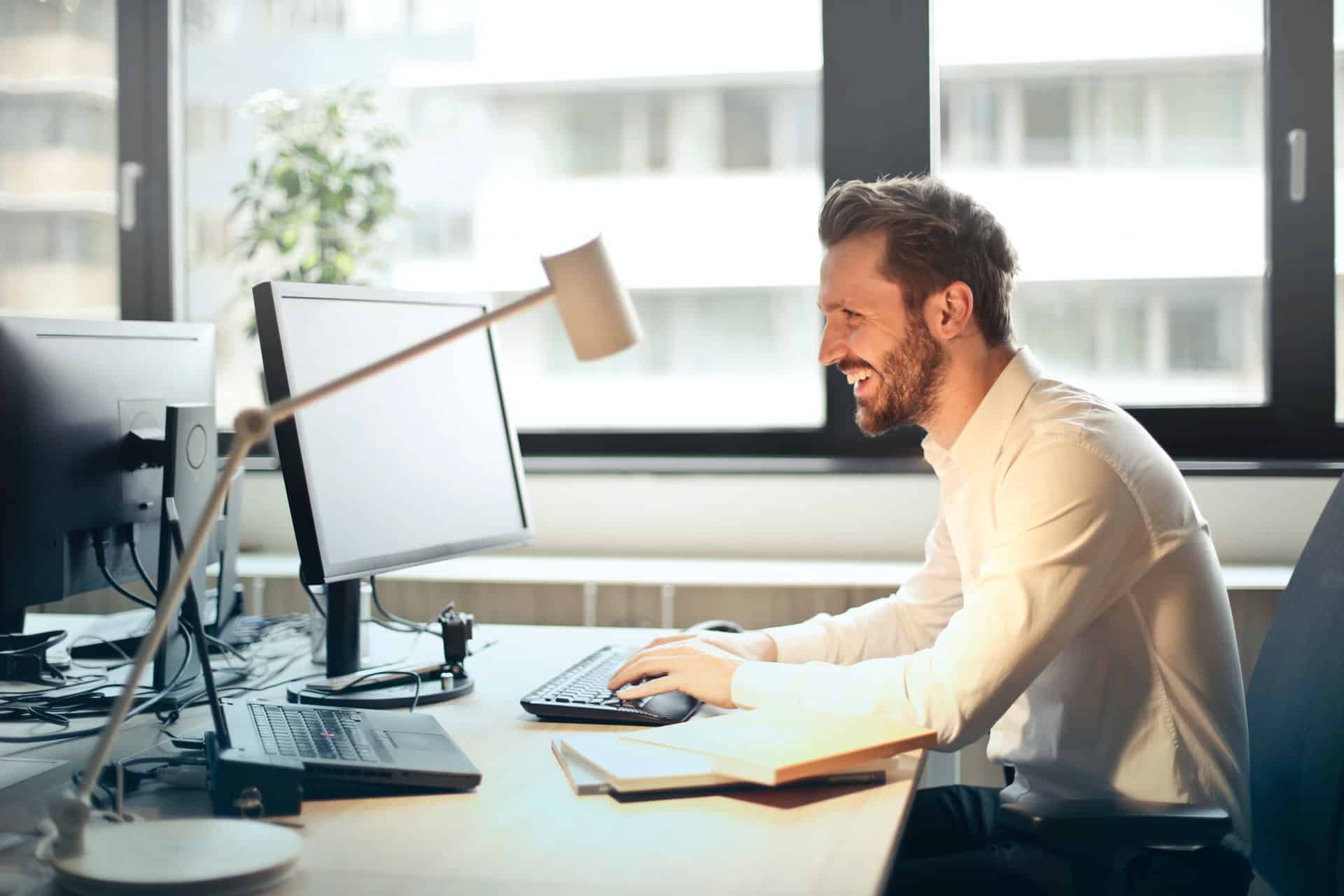 Man smiling in office