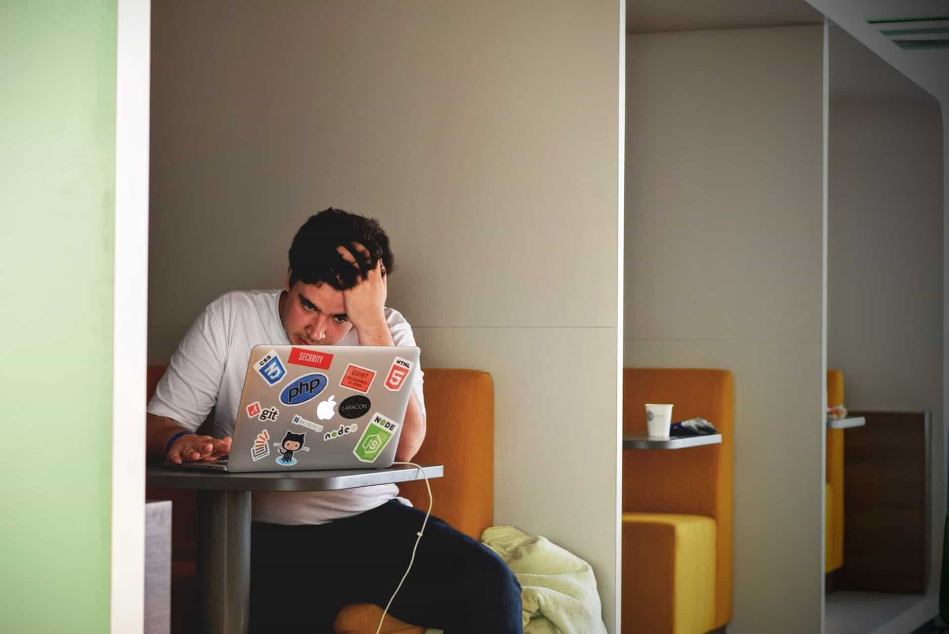 Man stressed over laptop