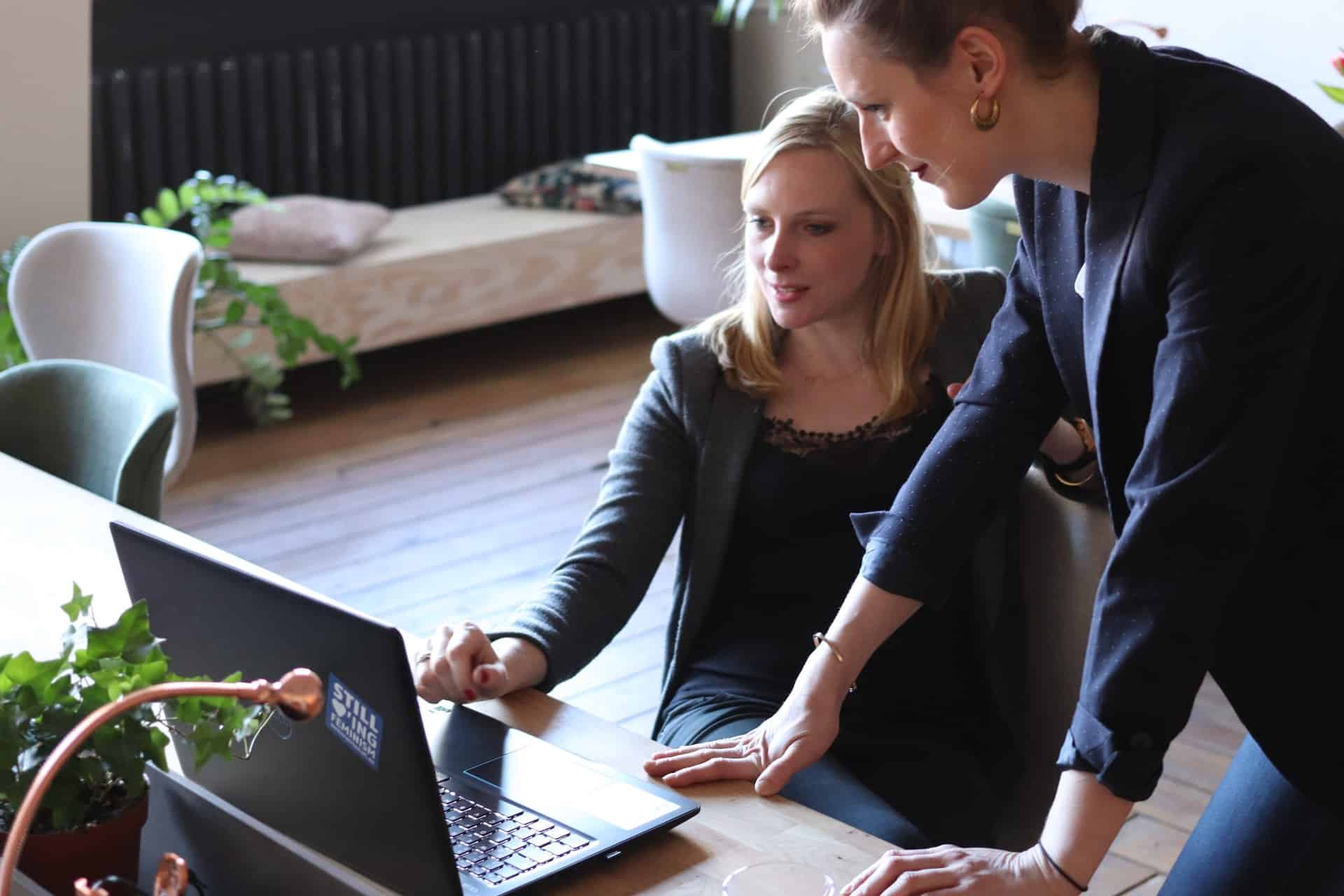 Women looking at laptop together