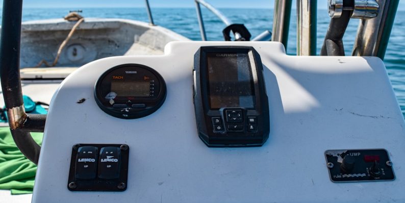 a close up of a cell phone on a boat nansen dashboard, whale tracker, alert notification