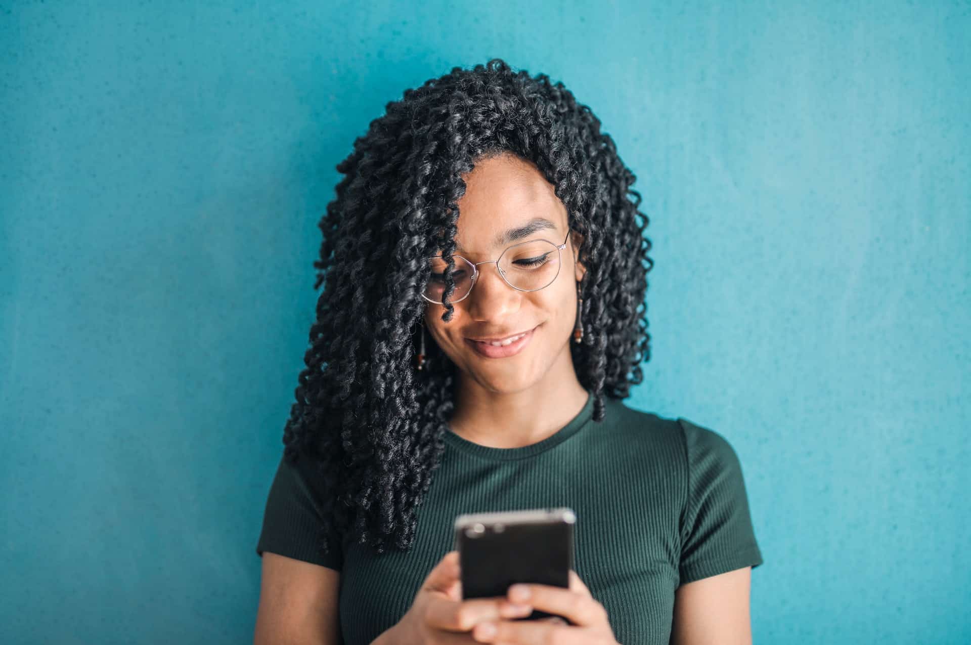 Woman smiling at phone