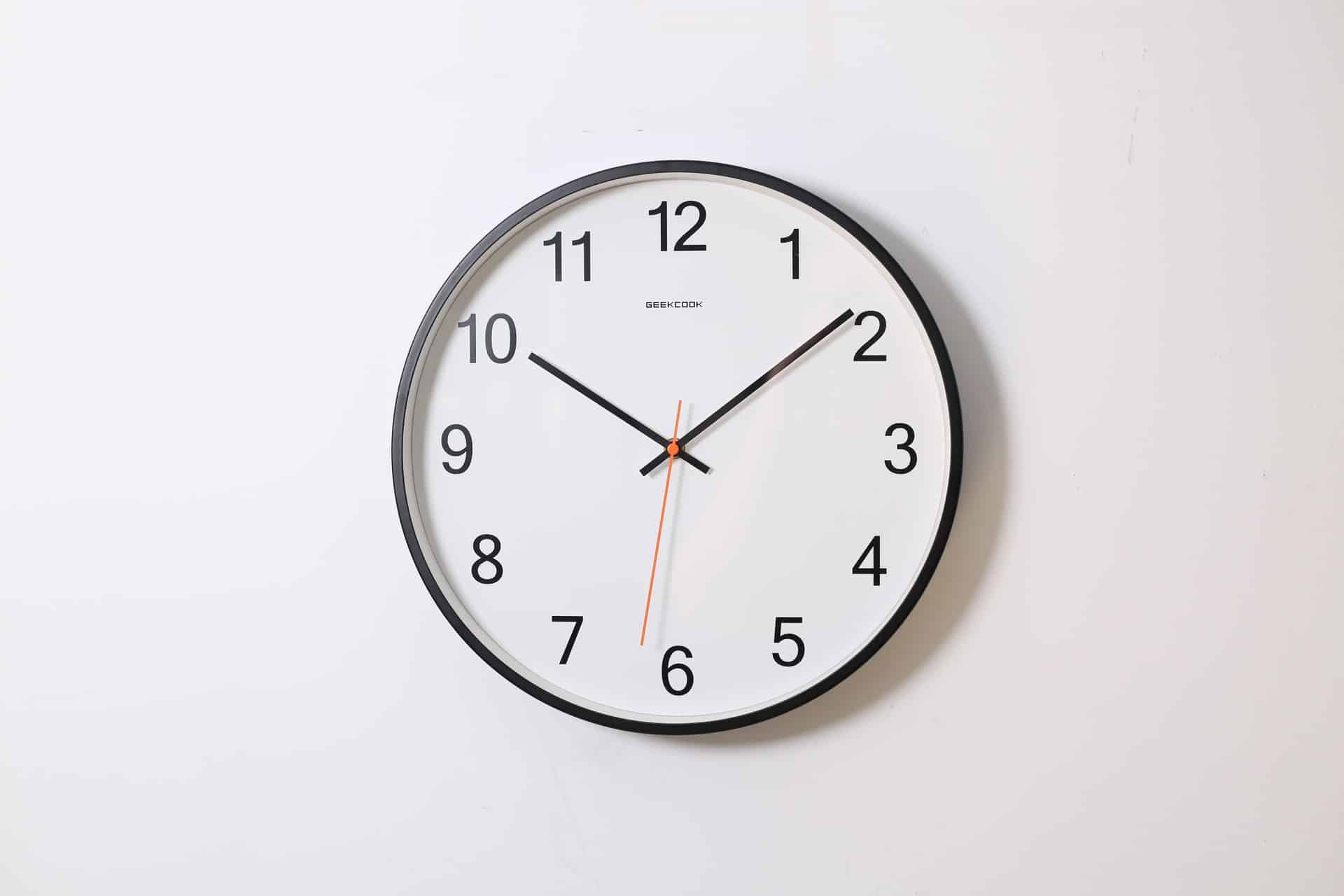 Plain clock on white wall