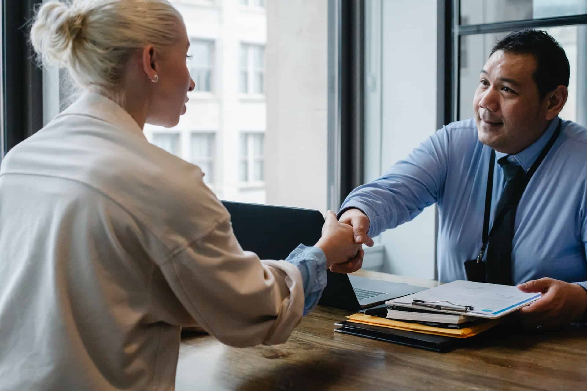 Woman and man shaking hands