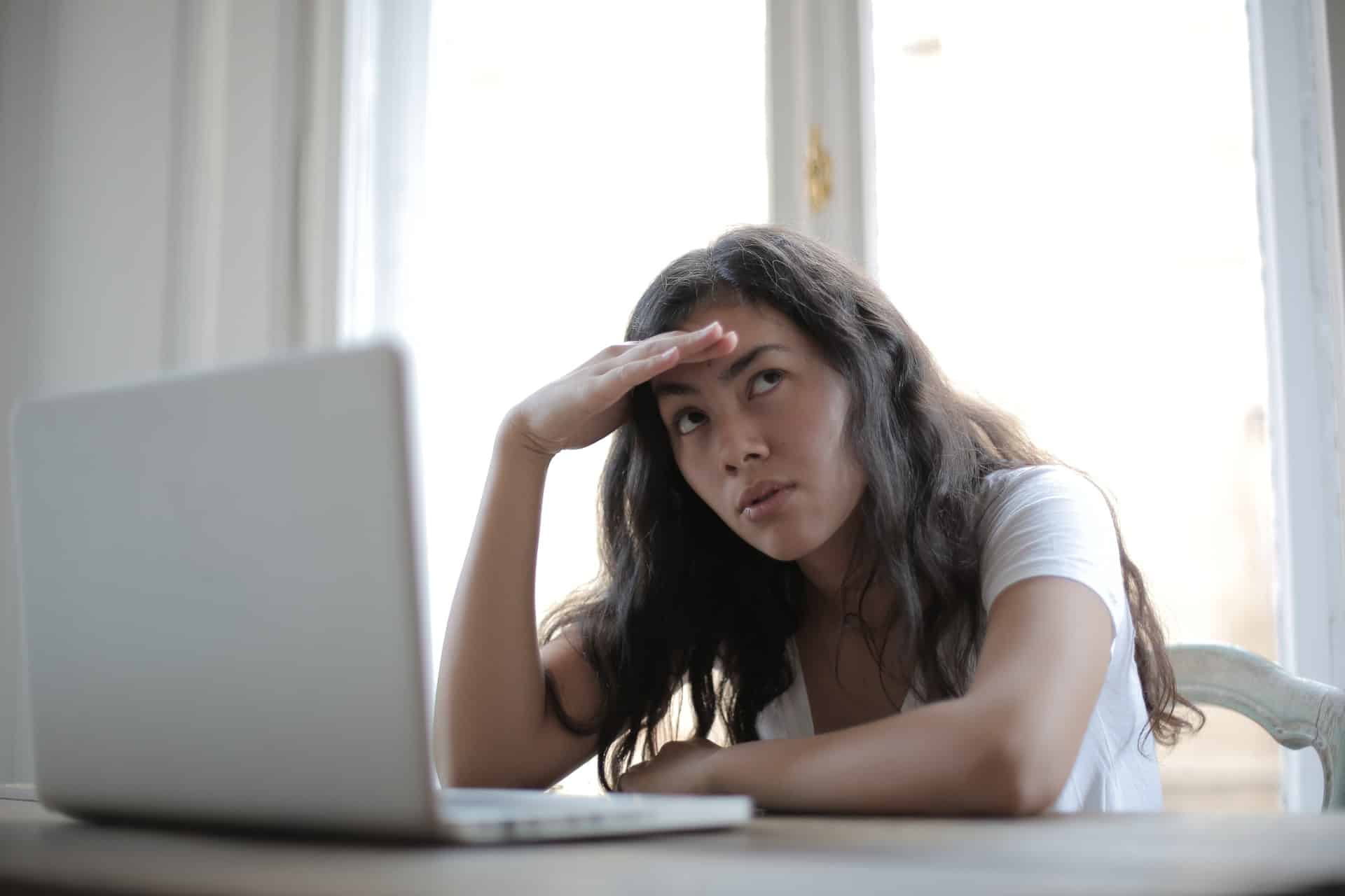 Woman annoyed at laptop