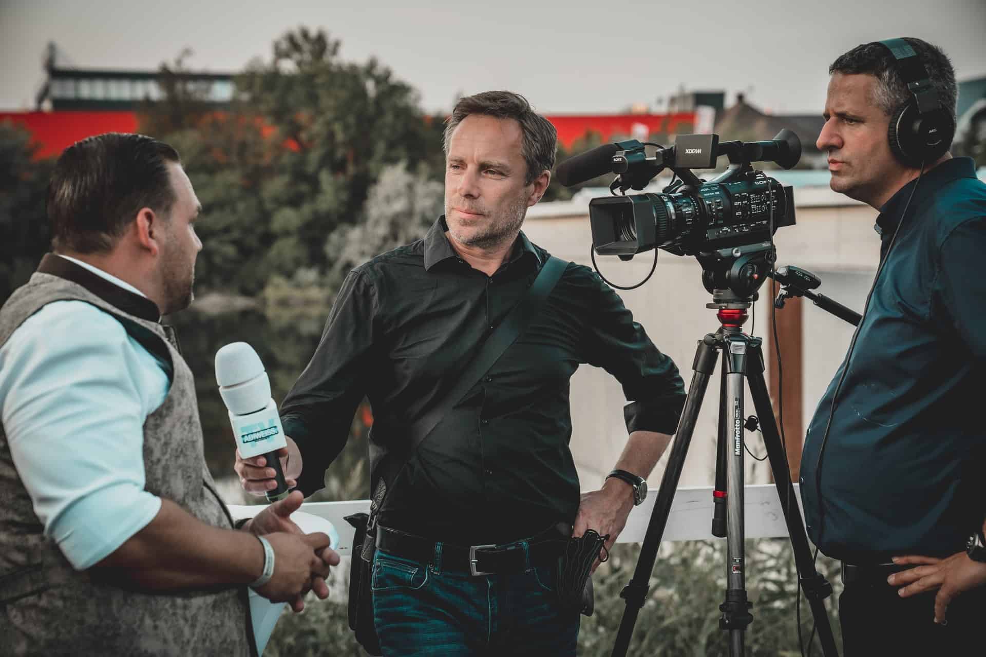 Man giving TV interview