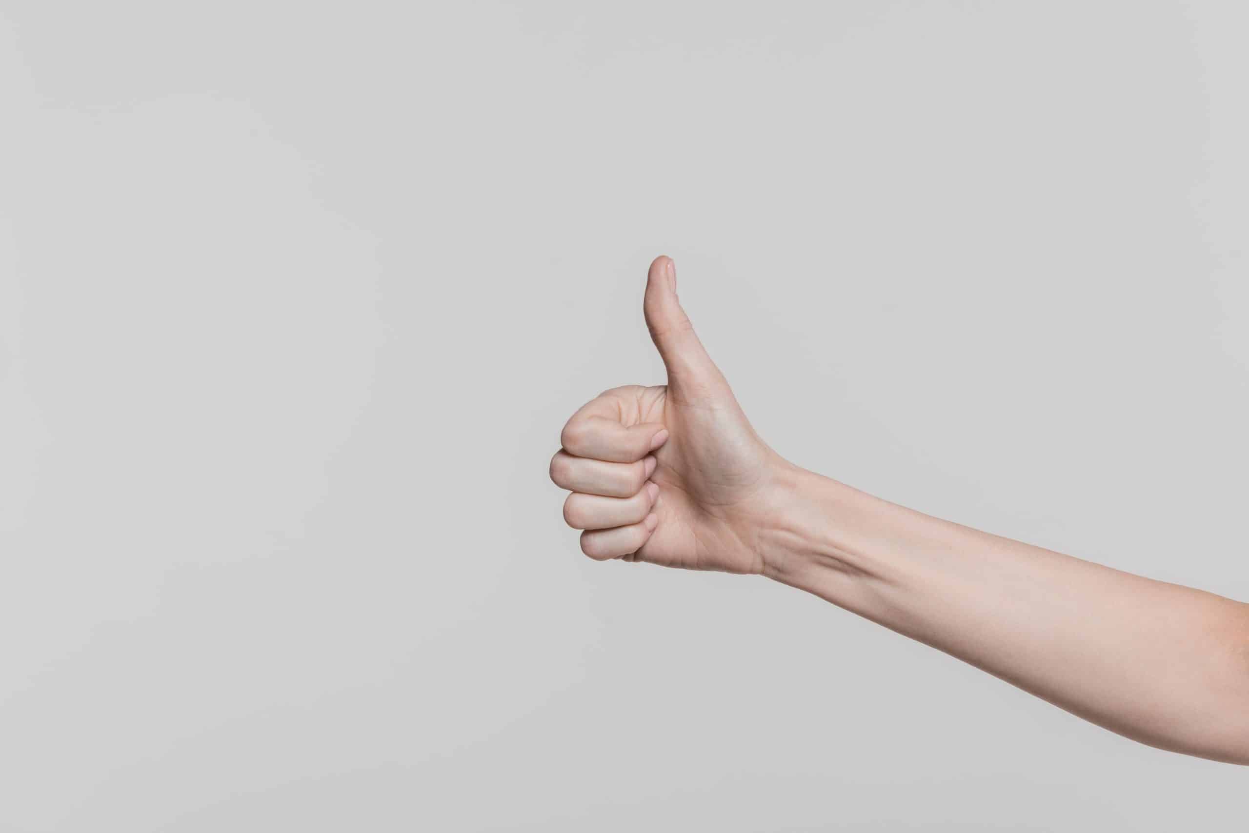Person showing thumbs up