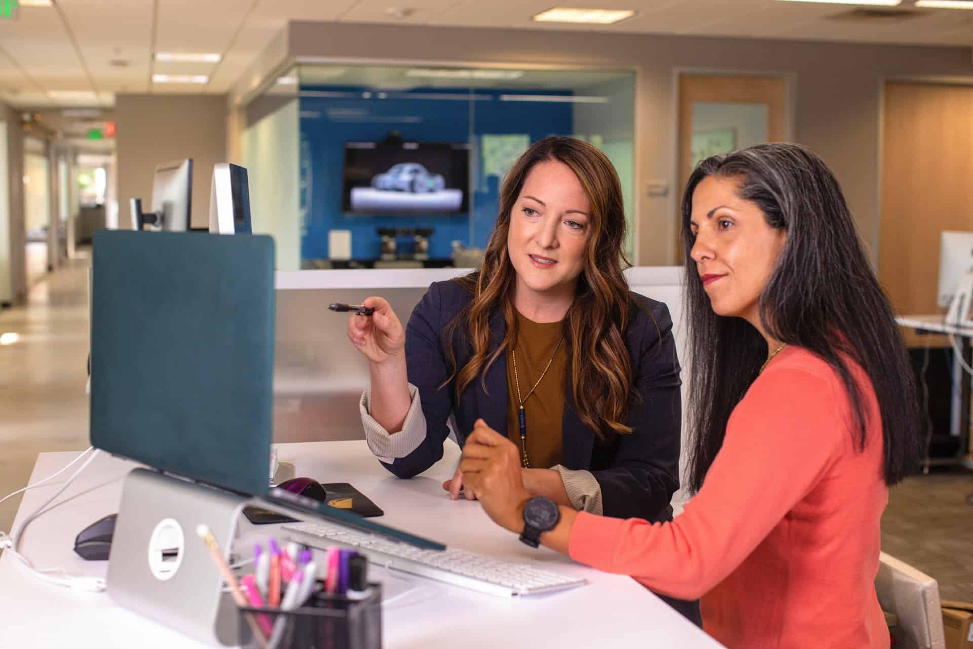 Two women working together