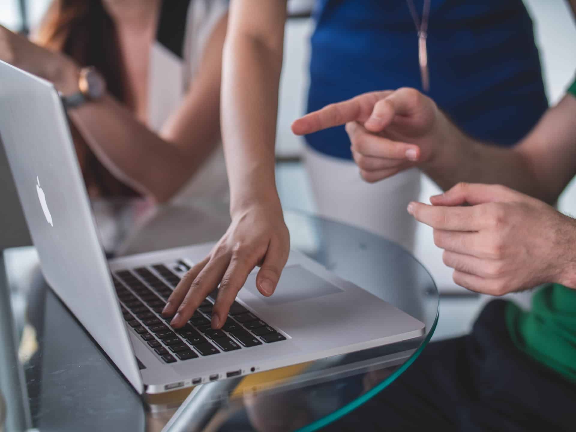 Man pointing at laptop