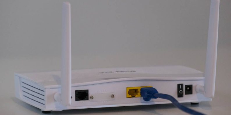 white router on white table slow internet connection, error message, wifi symbol