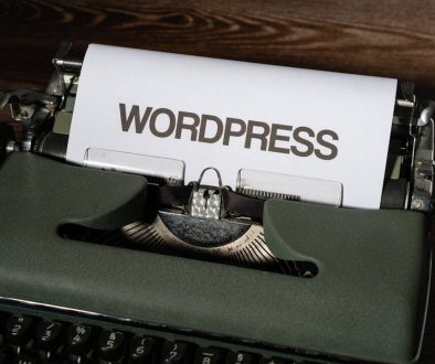 a close up of a typewriter with the word wordpress printed on it wordpress dashboard, ai writing, plugin settings