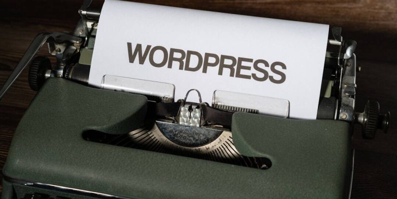 a close up of a typewriter with the word wordpress printed on it wordpress dashboard, ai writing, plugin settings