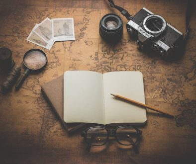 flat ray photography of book, pencil, camera, and with lens crypto map, digital currencies, regulation