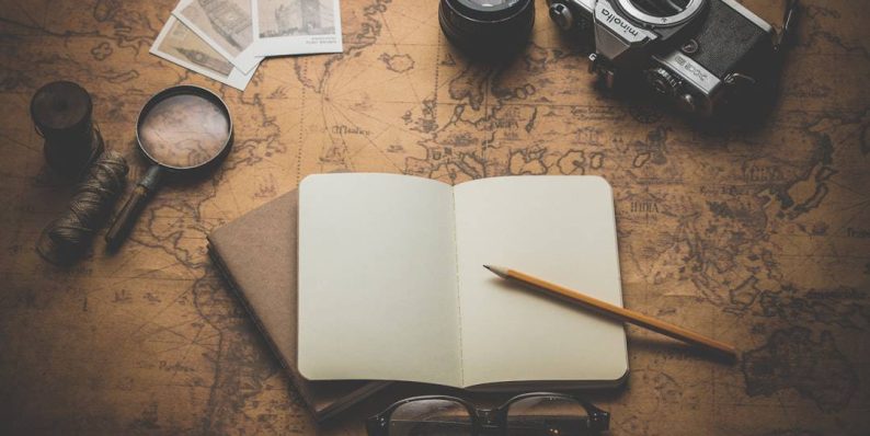 flat ray photography of book, pencil, camera, and with lens crypto map, digital currencies, regulation