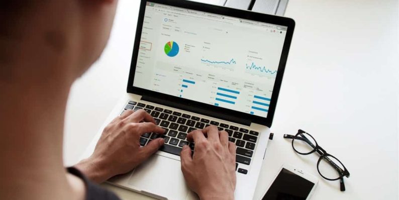 person using MacBook Pro data crowdsourcing blockchain collaboration