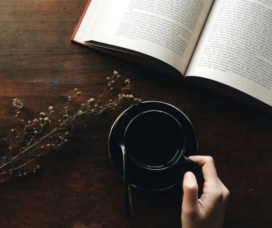 round black metal container near white book open ai reading notes, editing content, brainstorming ideas