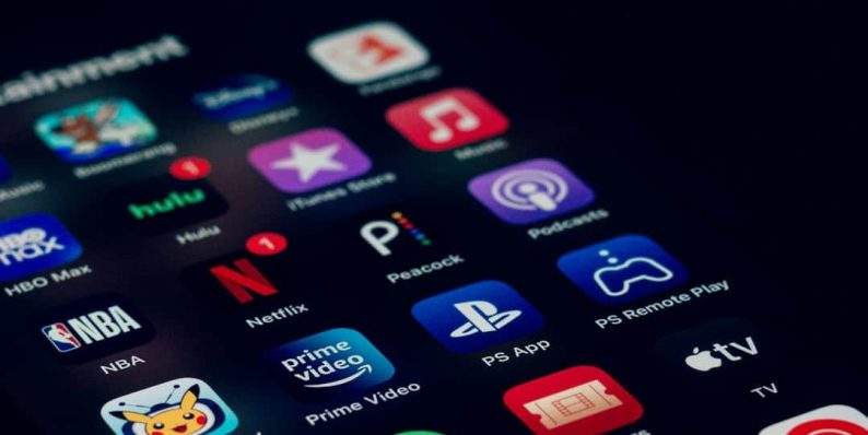 a close up of a cell phone with many different app icons mobile streaming,content personalization,technology team