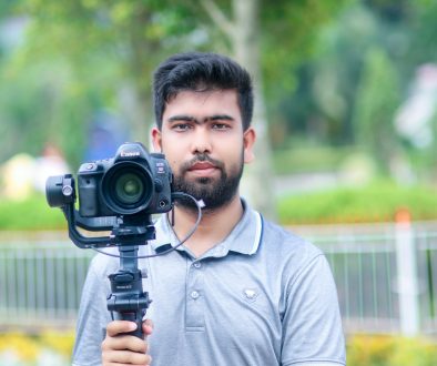 a man holding a camera iphone video editing, professional mobile editor, lumafusion
