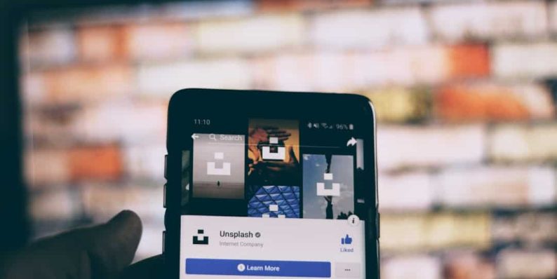 black smartphone turned on mobile streaming,content personalization,technology team