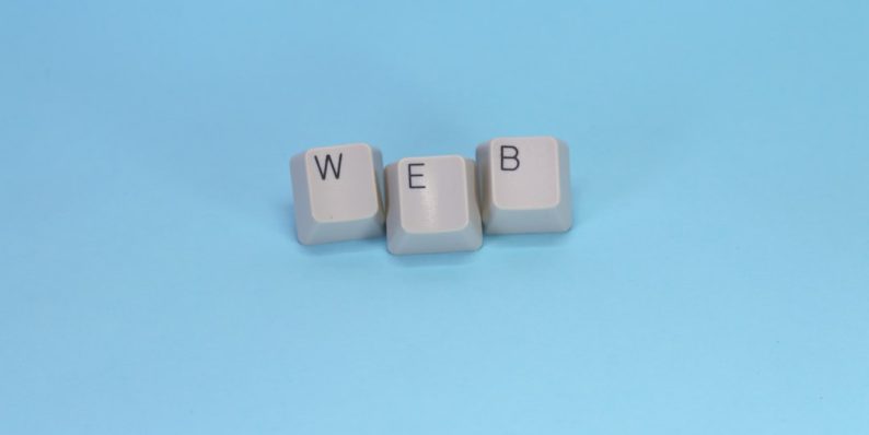 Keyboard keys spell out the word "web." wordpress error messages, broken site, website down