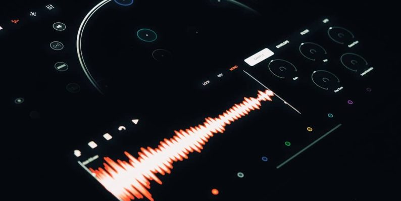 A close up of a remote control with a sound wave audacity interface, audio editing, user dashboard