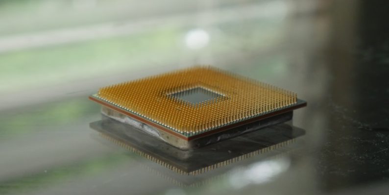 brown and black book on glass table intel cpu, laptop processor, i7 4300mq