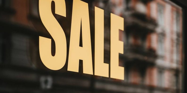 yellow sale text printed on glass window tiktok ecommerce, smartphone shopping, video marketing