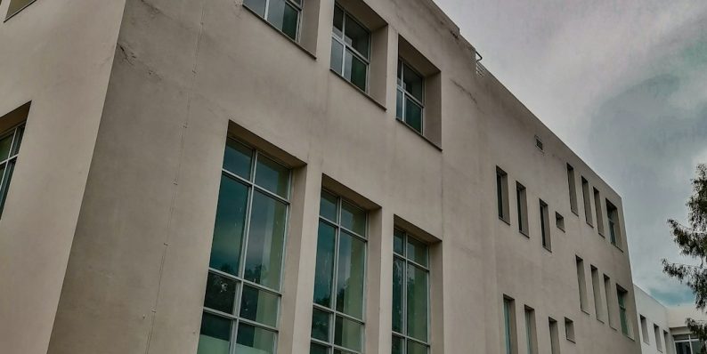 a building with glass windows google campus, sunnyvale office, modern architecture