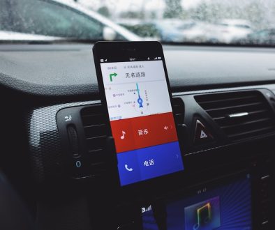 a car dashboard with a cell phone in it device manager, windows settings, driver update