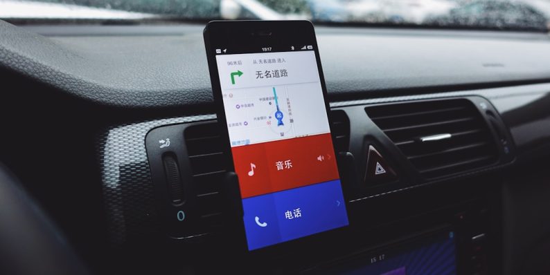a car dashboard with a cell phone in it device manager, windows settings, driver update