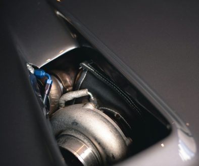 a close up of a car's exhaust system car engine, ignition system, wires, spark plugs
