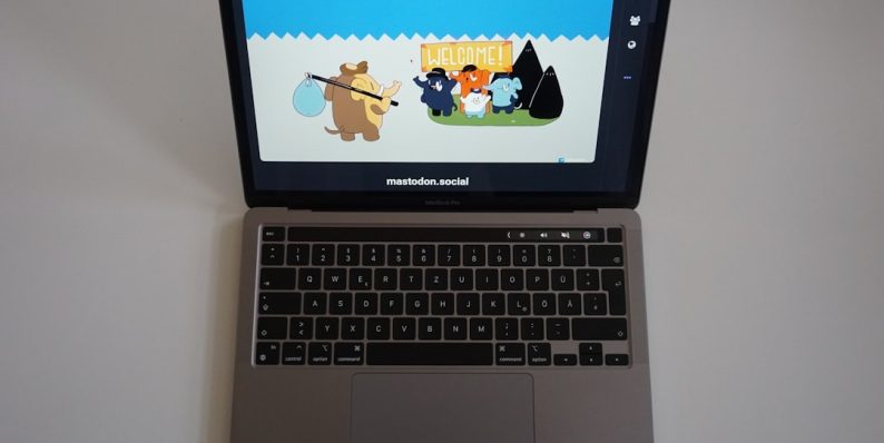 a laptop computer sitting on top of a white table happy user laptop browsing ad free