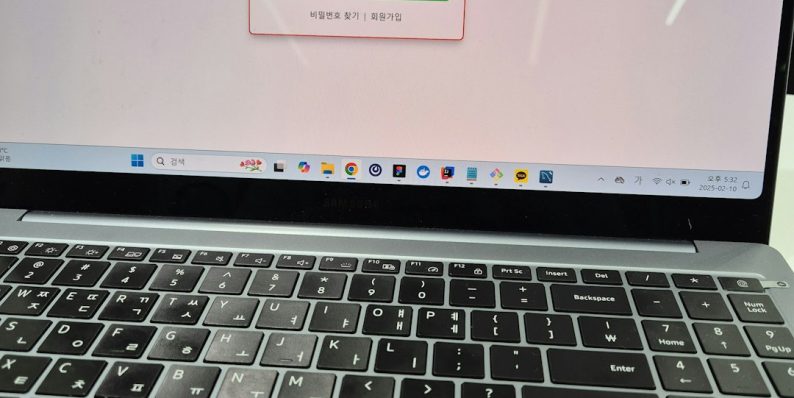 A laptop screen displaying a login form. windows update, driver installation, laptop restart
