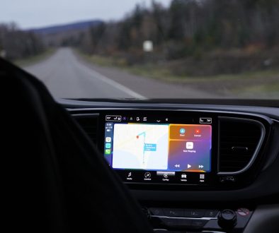 a man driving a car with a gps device in his hand device manager, windows settings, driver update