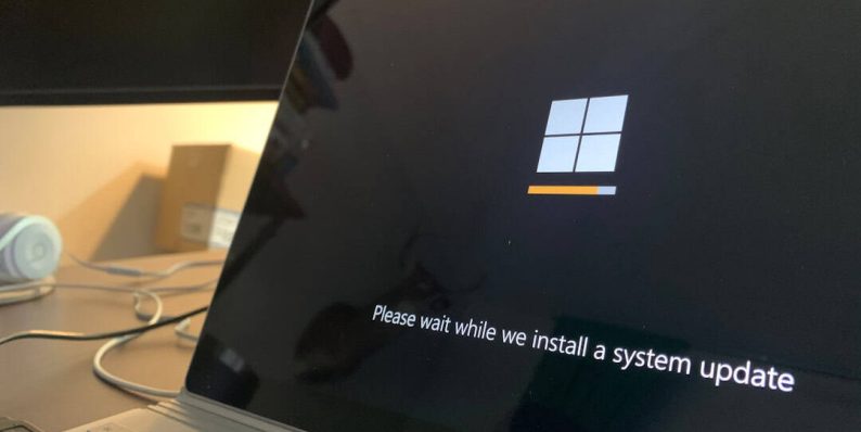 black and white laptop computer windows update, driver installation, laptop restart
