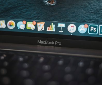 black lenovo laptop computer turned on displaying icons macbook thumb drive usb port
