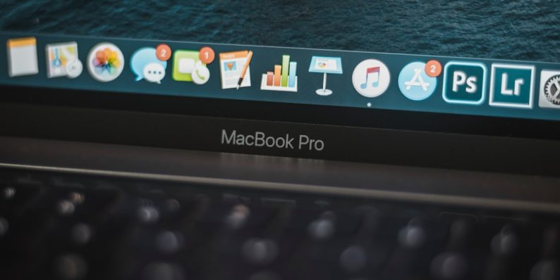 black lenovo laptop computer turned on displaying icons macbook thumb drive usb port