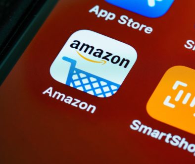 black smartphone showing logo guessing game amazon search history, online shopping, privacy settings