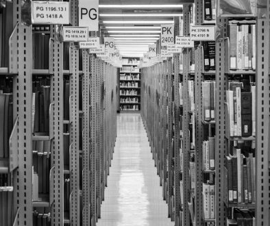 Library shelves stretch into the distance. large files, storage management, macbook finder