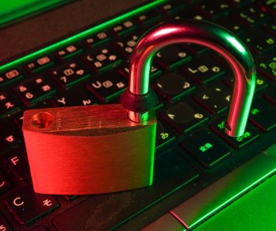 red padlock on black computer keyboard phishing email, data breach, device isolation