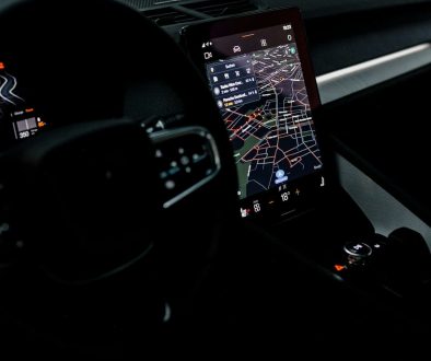the dashboard of a car with a gps device device manager, windows settings, driver update