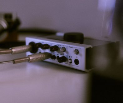 a close up of a stereo equipment on a table dongle dac, computer audio, usb c adapter