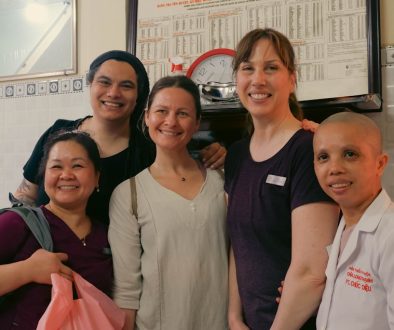 A group of people standing next to each other corporate volunteers, office team event, employees giving back