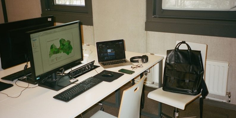 a white desk with a laptop and a computer on it laptop lock kensington desk office