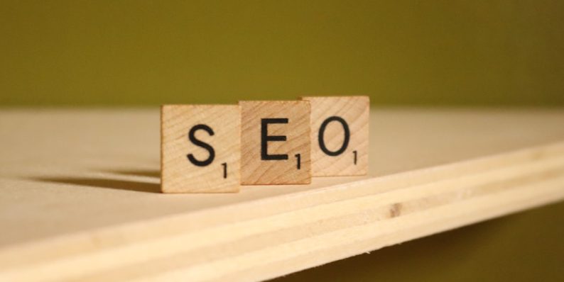 a wooden block that says seo on it utm tags, website tracking, marketing analytics