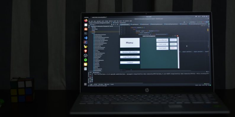 black hp laptop computer turned on displaying desktop timeline editing, video software interface, zoom tool